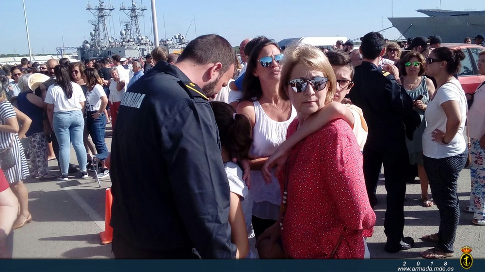 Family members bidding farewell on the pier